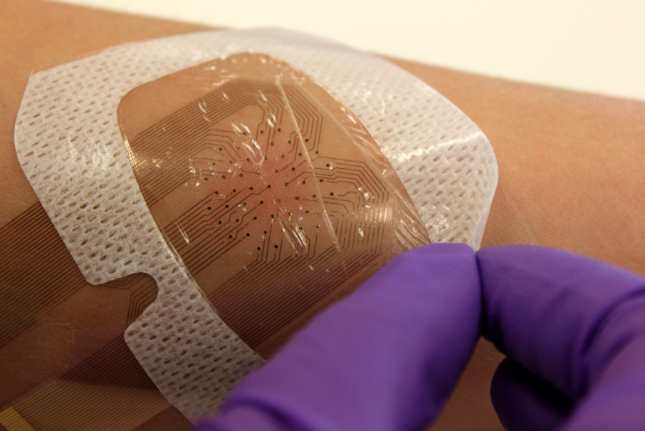 Photo of a printed circuit applied to skin like a band-aid